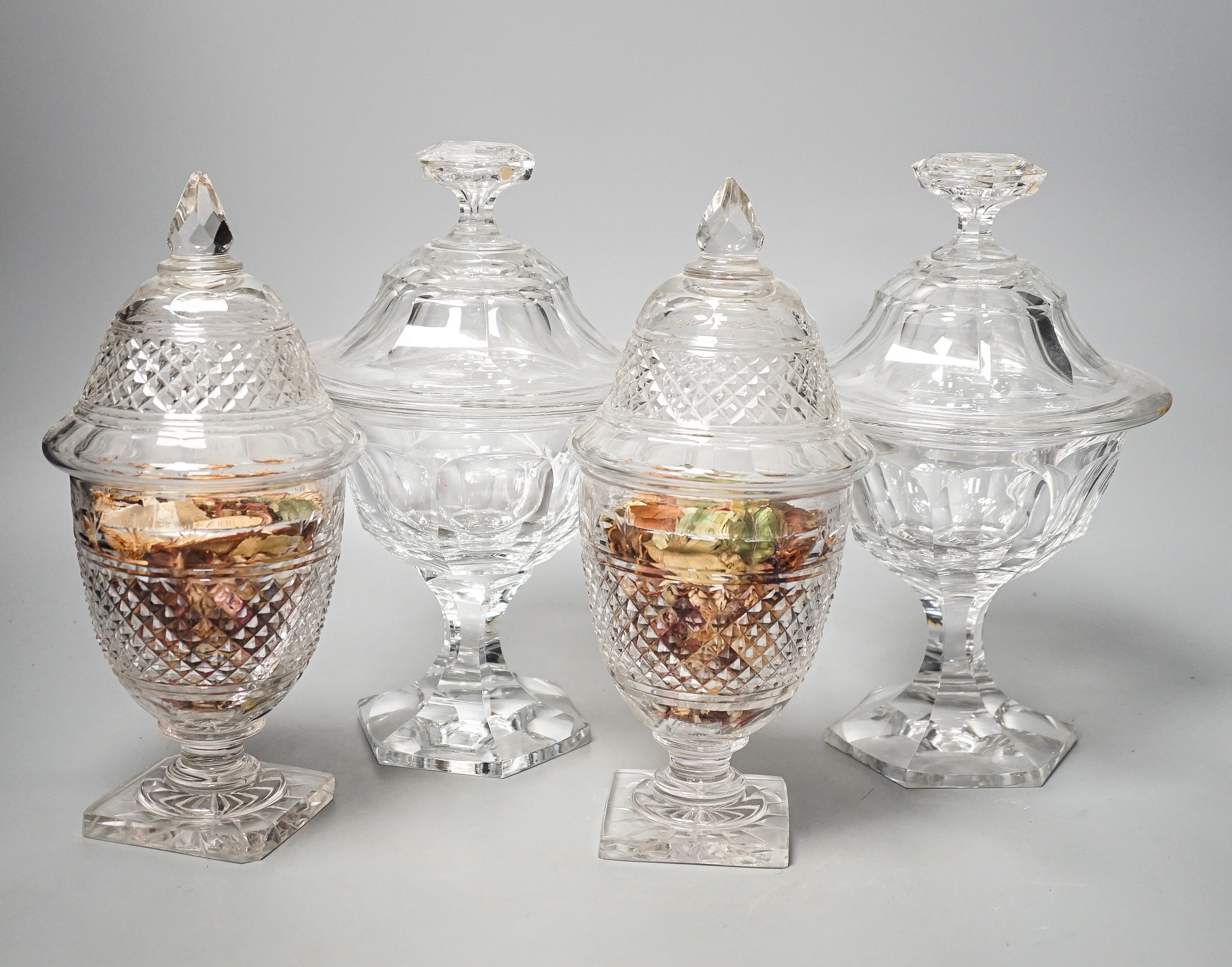 Two pairs of 19th century cut glass glass sweetmeat jars and covers (one a.f.), tallest 25 cms high.